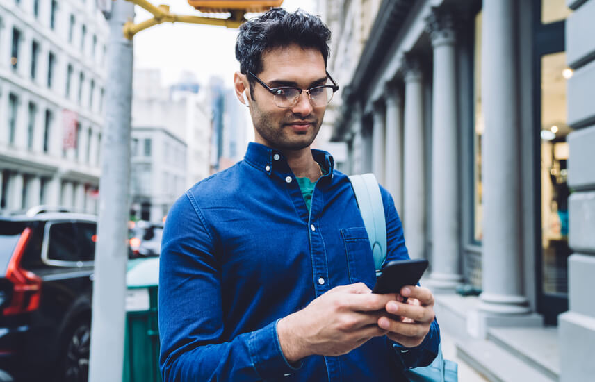 A person looking at text messages on a smartphone.