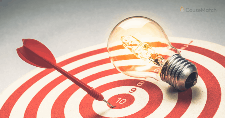 A target with the center hit, and a light bulb