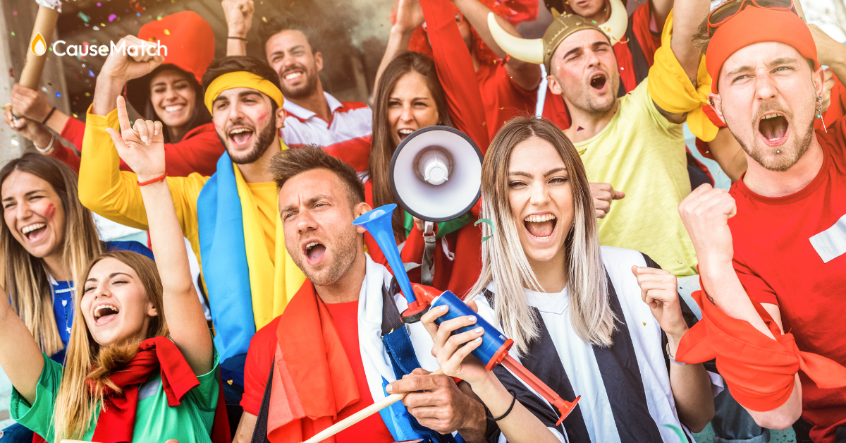Supporters in a crowd cheering