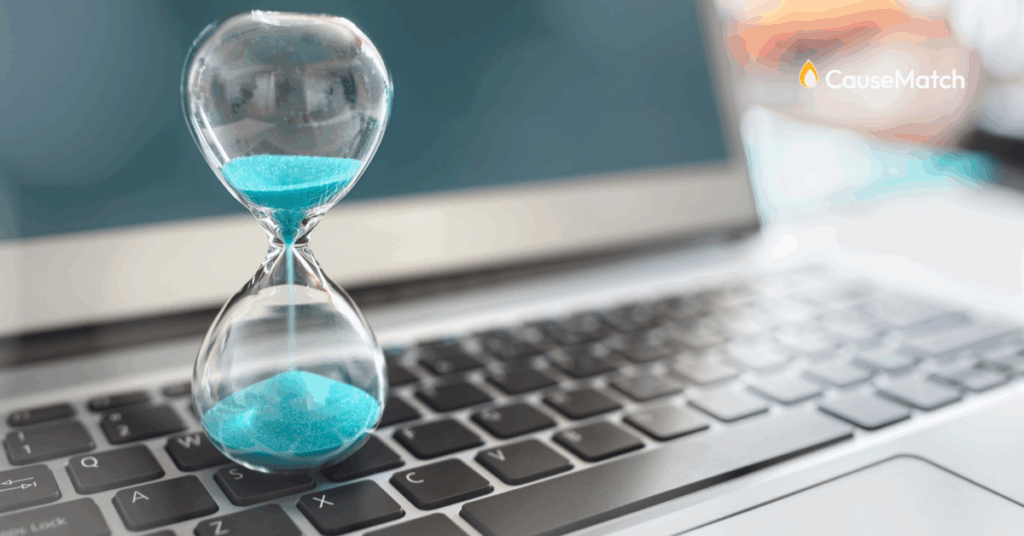 Sand clock running out of time on a computer keyboard