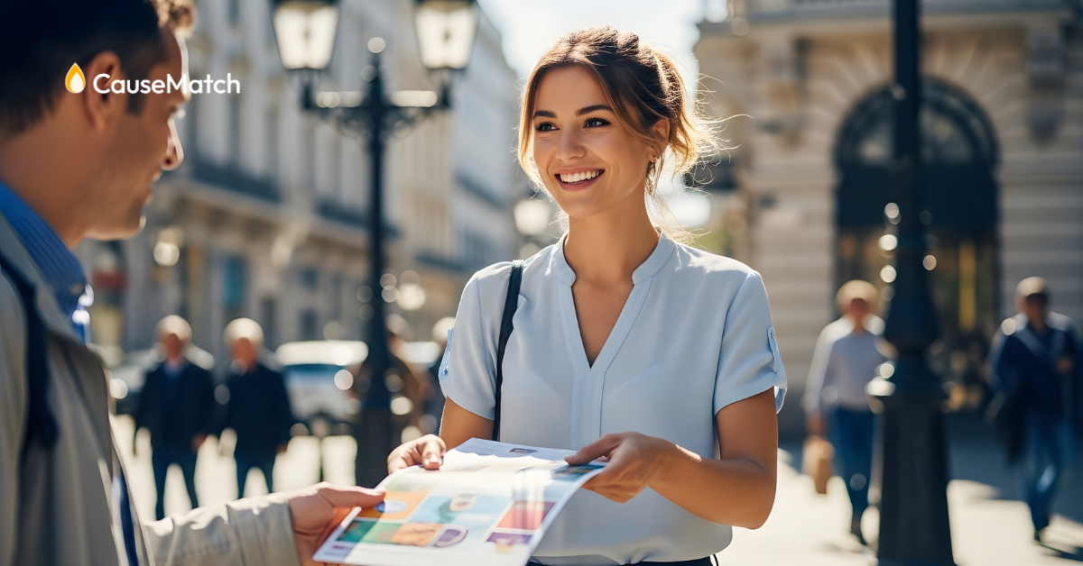 Women handing a man a flier